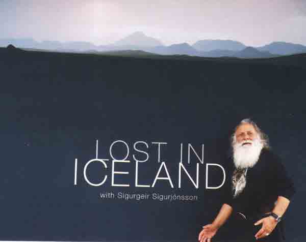 Francis posing in front of the poster - Lost in Iceland